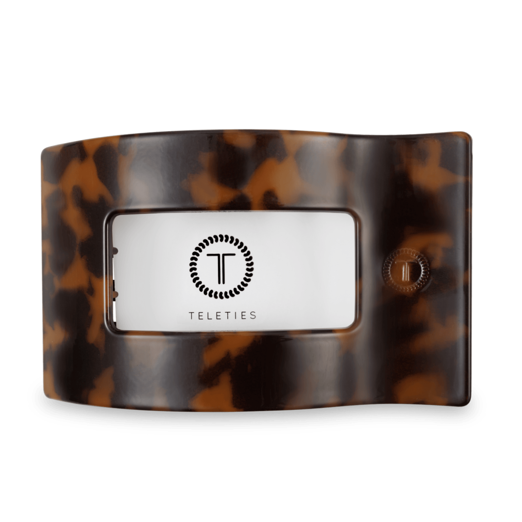 Large flat rectangular tortoise shell hair clip with brand label on underside