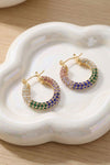 Rhinestone statement hoop earrings with multicolor stone border, gold-tone frame