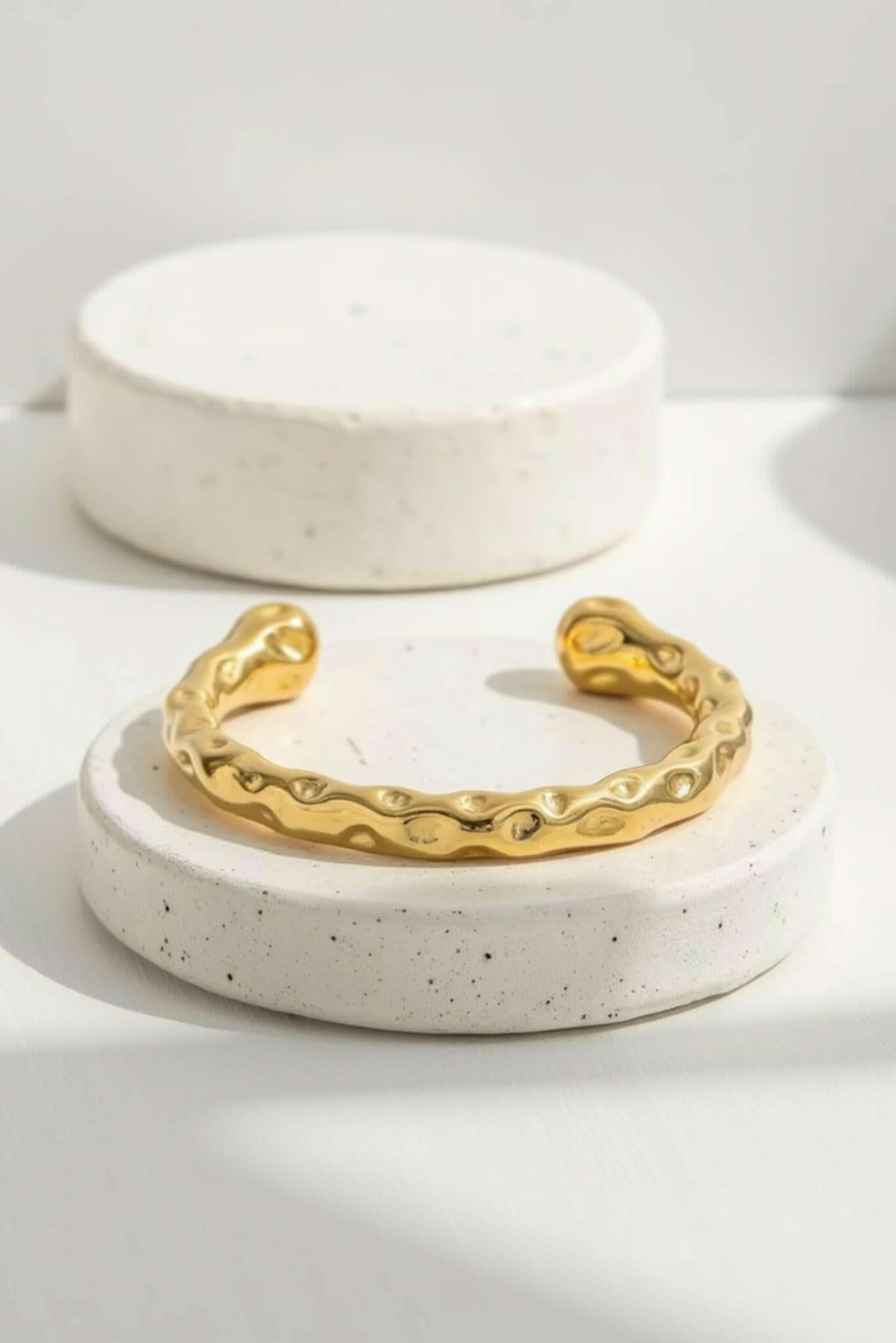 Gold textured cuff bracelet with wavy hammered finish